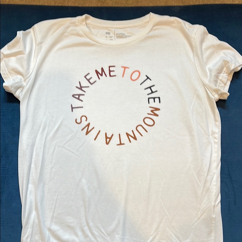 White “Take me to the mountains” Tee by Ten Tree.